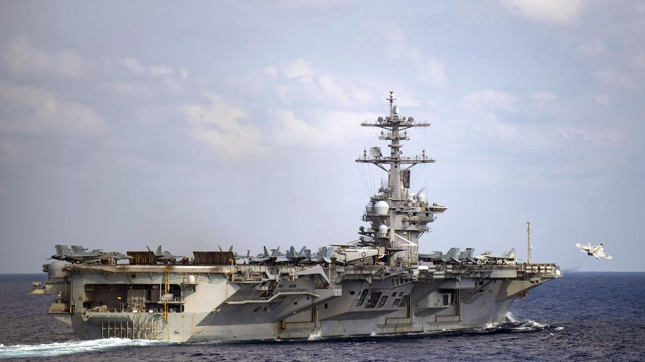 An F/A-18F Super Hornet launches from the USS Theodore Roosevelt in March. A coronavirus outbreak recently took the ship and crew out of action. Picture: Nicholas V. Huynh / U.S. navy via AP