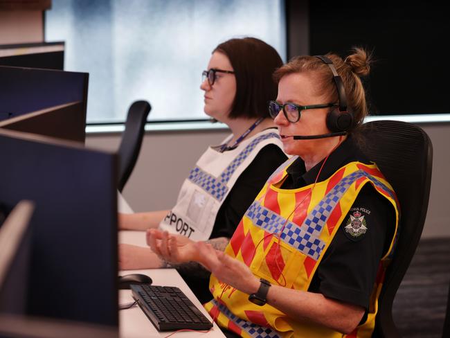 Officers taking calls and information shared from other agencies in the command centre. Picture: David Caird