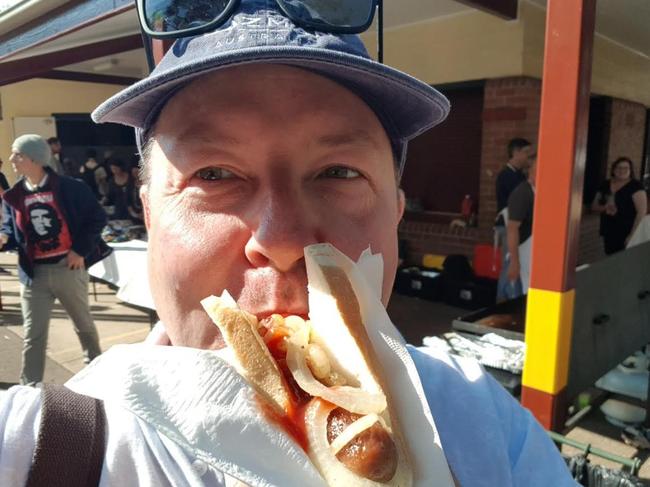 Matt Taylor having a sausage sandwich at Ryde