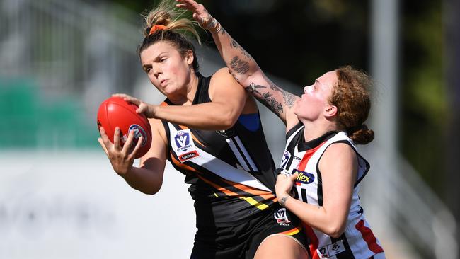 Jordann Hickey of NT Thunder marks in front of Tilly Lucas-Rodd of the Southern Saints Picture: Felicity Elliott/AFLNT Media)