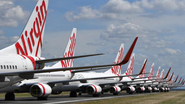 Grounded Virgin Australia aircraft are seen parked at Brisbane Airport in Brisbane in April last year. Picture: AAP Image