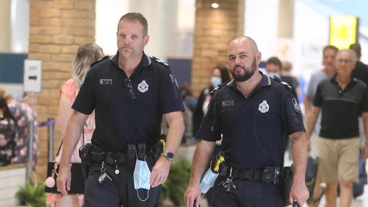 Queensland police on patrol at Brisbane airport following a resurgence in COVID restrictions. Picture: Richard Gosling