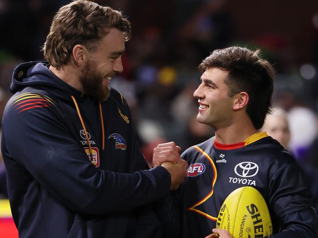 ADELAIDE, AUSTRALIA - JUNE 15: Riley Thilthorpe and Josh Rachele of the Crows before the 2024 AFL Round 14 match between the Adelaide Crows and the Sydney Swans at Adelaide Oval on June 15, 2024 in Adelaide, Australia. (Photo by James Elsby/AFL Photos via Getty Images)