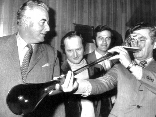 Bob Hawke skolls a yard glass in front of Gough Whitlam in the 1970s. Picture: Supplied