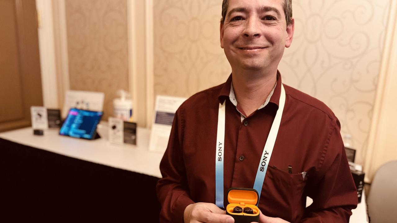 xMEMS Labs director of marketing Zachi Friedman with a set of the company's ultrasonic earbuds.