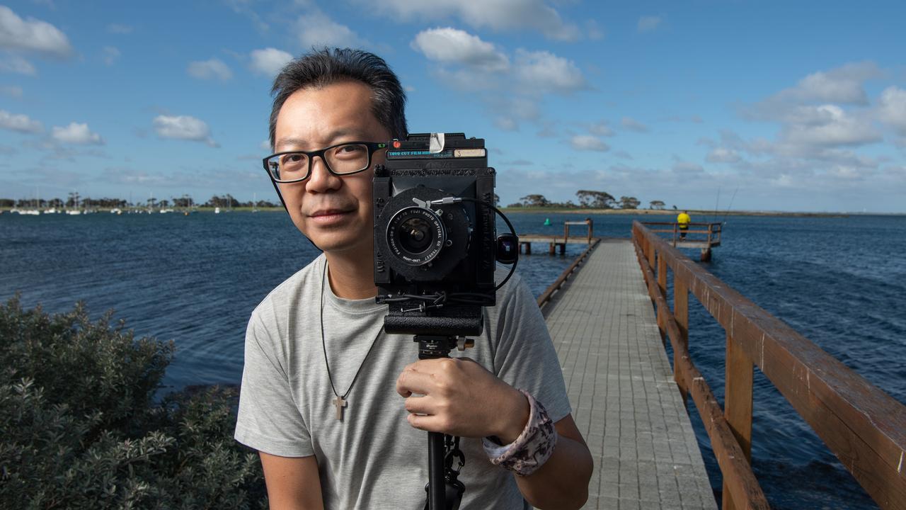 Hong Kong photographer Simon Wan, pictured at Grammar Lagoon, walked from Melbourne to Geelong, photographing things along the way for an exhibition. Picture: Brad Fleet