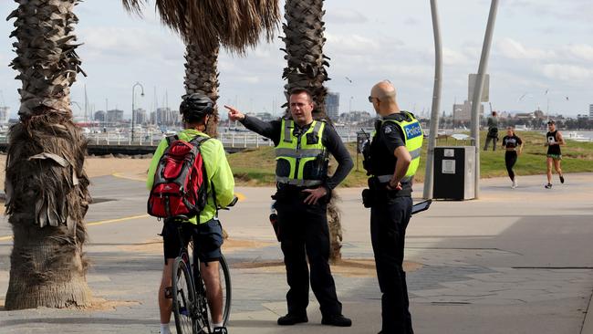 Police patrol Vicoria’s St Kilda Beach Foreshore. Picture: David Geraghty / The Australian.