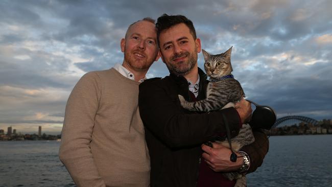 Nathan Thomas and Maikol Nobrega with their cat Charlie. Picture: AAP Image/Ashley Feder