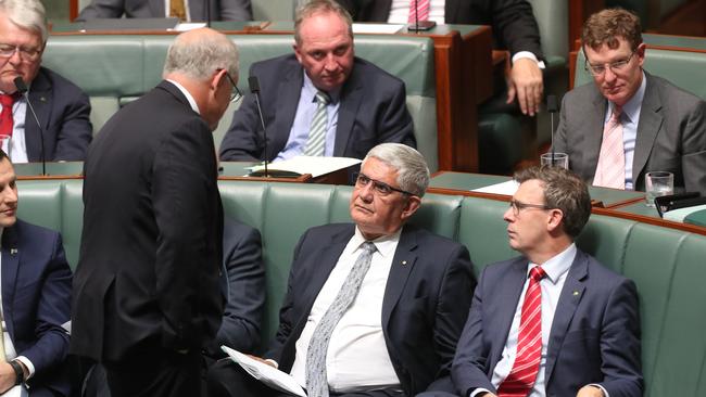 Prime Minister Scott Morrison speaks to Ken Wyatt during Question Time in Canberra. Picture: Kym Smith