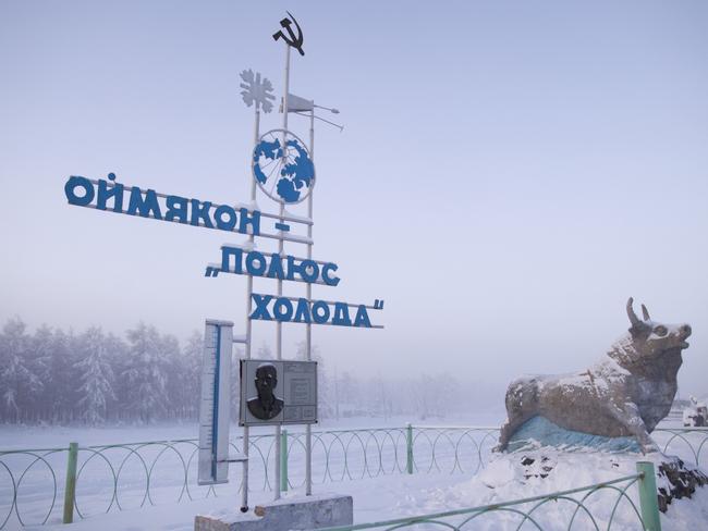 Communist-era monument marking the record-breaking temperature of -71.2 recorded in the village in 1924. It reads “Oymyakon, the Pole of Cold”. Picture: Amos Chapple/REX/Shutterstock/Australscope