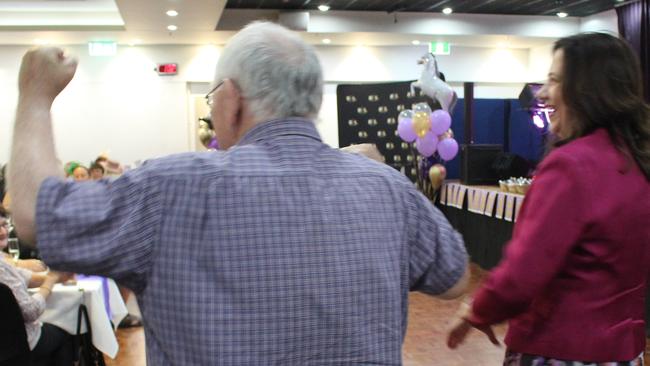 The crowd cheered as Premier Annastacia Palaszczuk entered the room.