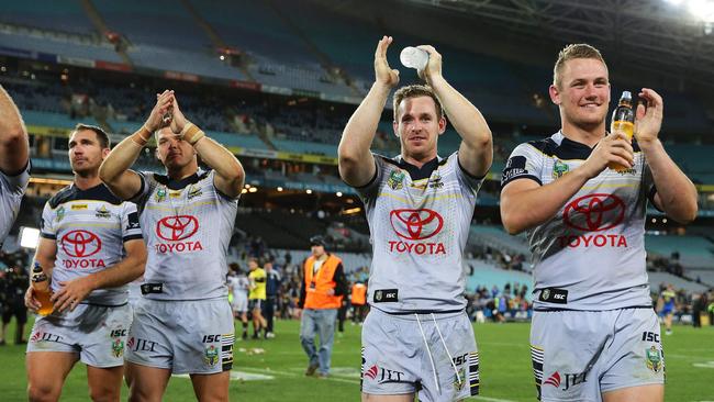 Michael Morgan, Coen Hess and the Cowboys celebrate victory over the Eels. Picture: Brett Costello