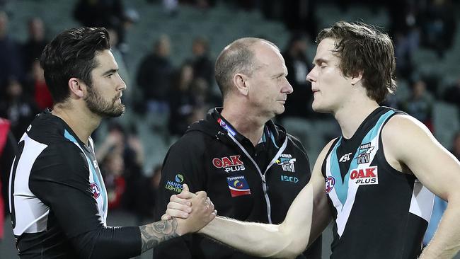 Chad Wingard with Jared Polec and Ken Hinkley after the Power’s final-round loss. The Power could be without both players next year. Picture Sarah Reed