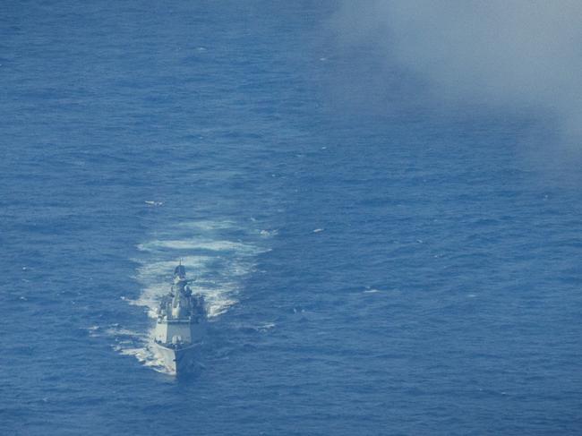 SCARBOROUGH SHOAL, SOUTH CHINA SEA - FEBRUARY 18: A Chinese Navy warship sails near the waters of Scarborough Shoal, as seen from aboard a Philippine Bureau of Fisheries and Aquatic Resources plane on February 18, 2025 in the South China Sea. A Chinese Navy helicopter nearly collided with a Philippine Bureau of Fisheries and Aquatic Resources plane in the latest flare-up of tensions between the two countries in the disputed waters. The incident occurred when the Chinese Navy deployed a helicopter to tail the Philippine civilian plane, which was conducting a routine maritime domain awareness flight over Scarborough Shoal, located within the Philippines' exclusive economic zone. (Photo by Ezra Acayan/Getty Images)