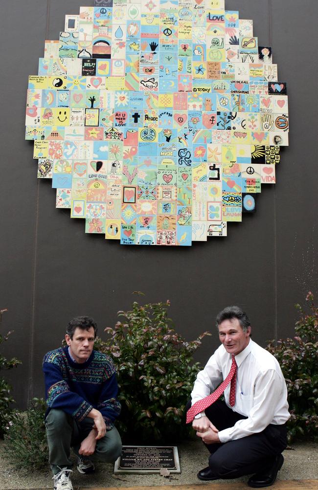 Prof Brett Inder and Dr Lee Gordon-Brown, awarded Bravery Awards for their roles, in front of a mural and plaque erected in the wake of the shooting. Picture: HWT library