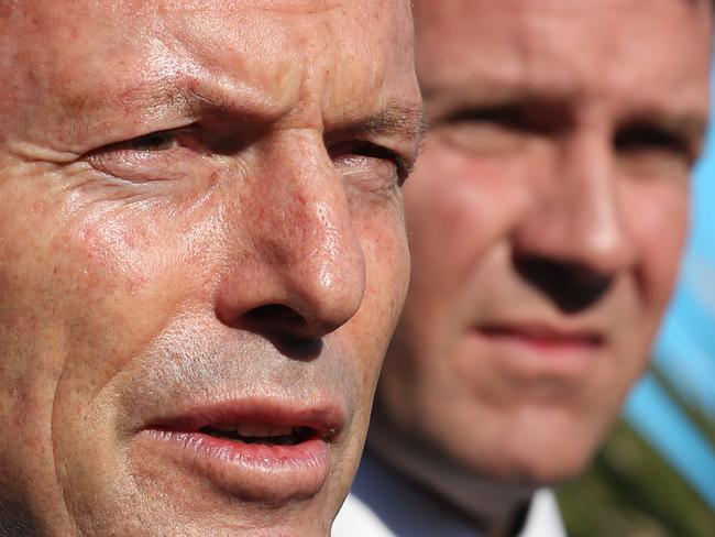 Australian Prime Minister Tony Abbott (L) stands next to NSW Premier Mike Baird during a media event to mark the early construction of the Westconnex stage 2 in Beverly Hills, Sydney, Monday, July 20, 2015. (AAP Image/David Moir) NO ARCHIVING