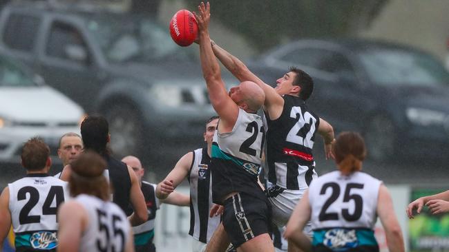 Castlemaine's Jackson Hoods tries to win the contest against Maryborough’s Ty Stewart. Picture: Peter Banko