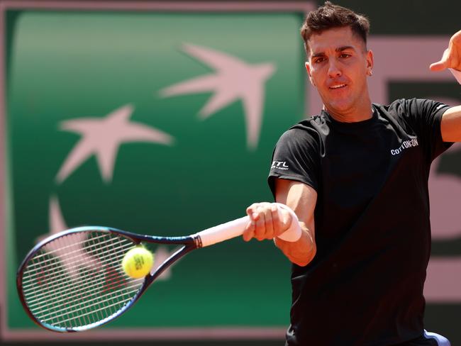 PARIS, FRANCE - MAY 28: Thanasi Kokkinakis of Australia plays a forehand against Daniel Evans of Great Britain during their Men's Singles First Round Match on Day One of the at Roland Garros on May 28, 2023 in Paris, France. (Photo by Clive Brunskill/Getty Images)