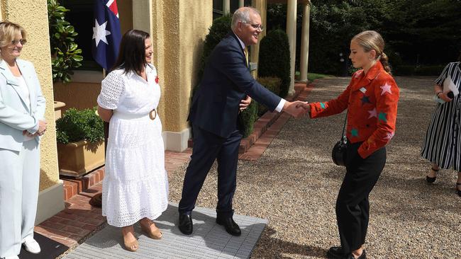 Grace Tame reluctantly shaking the Prime Minister’s hand. Picture: Gary Ramage