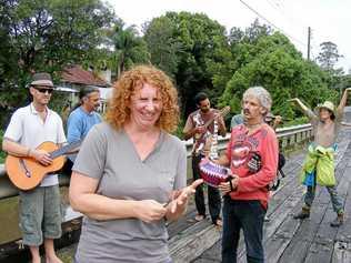 Getting ready to Occupy Nimbin Bridge, is organiser Belinda Marsh at the front with some of the musicians and music lovers who want the bridge kept. Picture: Mel McMillan