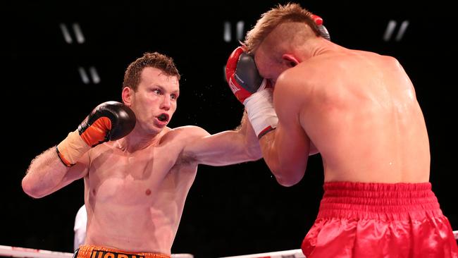 Jeff Horn lands a shot on Rico Mueller on Friday night.
