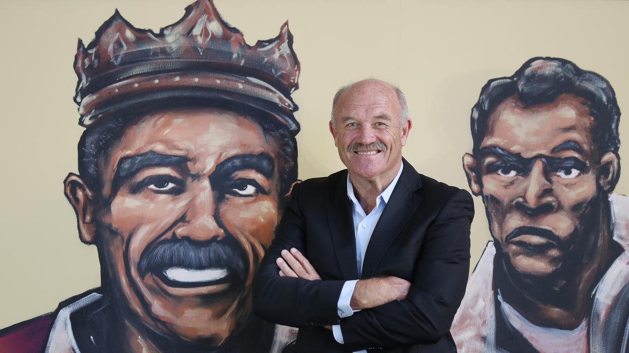 Wally Lewis with the NRL Greats mural wall. Pic Annette Dew