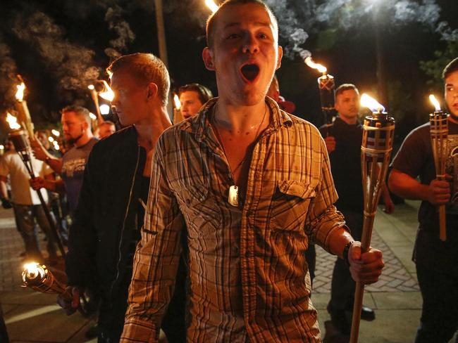 White nationalists demonstrate with torches on Friday night. Picture: Mykal McEldowney/The Indianapolis Star via AP