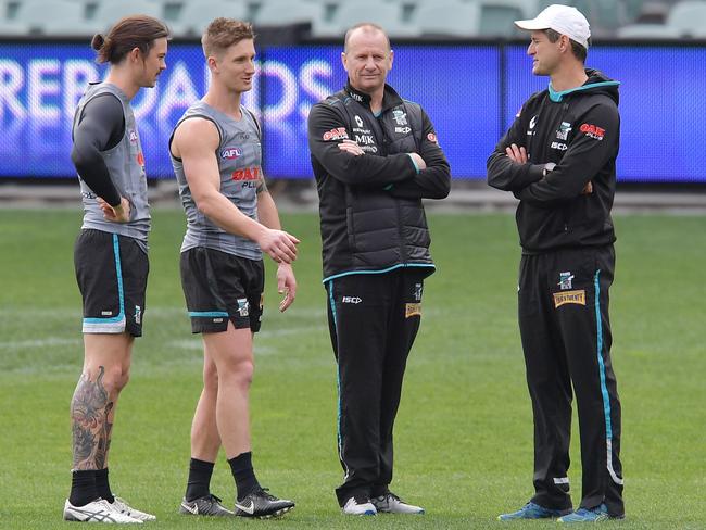 Port Adelaide players Jasper Pittard and Hamish Hartlett with coach Ken Hinkley and Nathan Bassett.