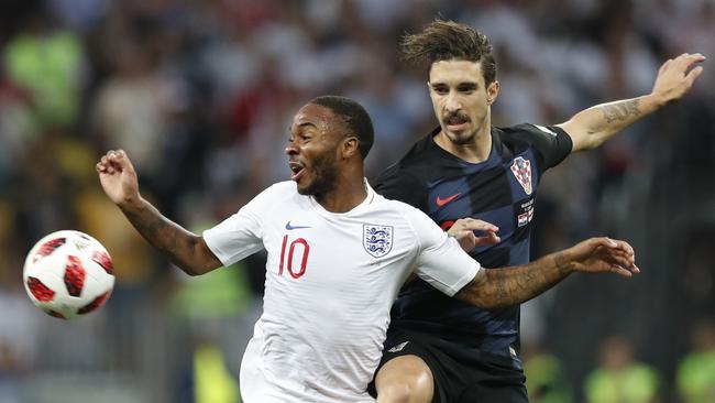 England's Raheem Sterling, left, and Croatia's Sime Vrsaljko challenge for the ball. Photo: AP