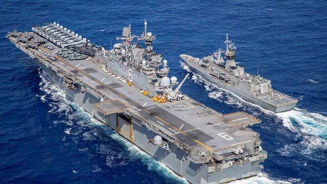 Photographer:LSIS Ernesto SanchezRelated Imagery:TS20210144Caption:HMAS Ballarat (right) and USS America conduct a replenishment at sea off the coat of Queensland, during Exercise Talisman Sabre 2021.Mid Caption:Exercise Talisman Sabre 2021 (TS21) is the largest bilateral training activity between Australia and the United States, commencing on 14 July 2021. A biennial exercise since 2003, held every two years, TS21 aims to test Australian interoperability with the United States and other participating forces in complex warfighting scenarios. In addition to the Unites States, TS21 involves participating forces from Canada, Japan, Republic of Korea, New Zealand, and the United Kingdom. The exercise includes of a Field Training Exercise incorporating force preparation (logistic) activities, amphibious landings, ground force manoeuvres, urban operations, air combat and maritime operations. With Activities will peak over the period from 18 – 31 July across Queensland. TS21 is a major undertaking for all attending nations and demonstrates the combined capability to achieve large-scale operational outcomes within a COVID-19 safe environment. read lessFile Date: