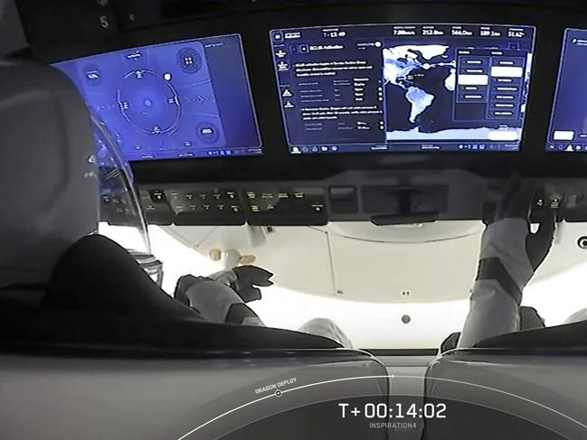 This screengrab taken from the SpaceX live webcast shows a view of the dashboard with pilot Sian Proctor (R) along with the Inspiration4 crew, Hayley Arceneaux, Jared Isaacman, and Christopher Sembroski, after blasting off from NASA's Kennedy Space Center in Florida, on September 15, 2021. - A SpaceX Dragon carrying four tourists separated from the second stage of a Falcon 9 rocket 12 minutes after liftoff, with the four tourists on board now in orbit, a video feed showed. (Photo by - / SPACEX / AFP) / RESTRICTED TO EDITORIAL USE - MANDATORY CREDIT "AFP PHOTO /  SPACEX " - NO MARKETING - NO ADVERTISING CAMPAIGNS - DISTRIBUTED AS A SERVICE TO CLIENTS