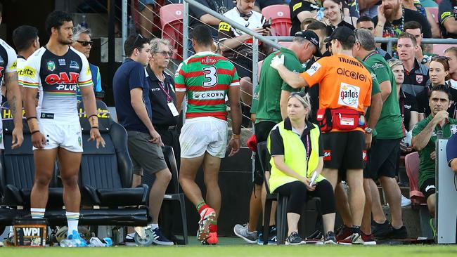 Greg Inglis of the Rabbitohs walks up the tunnel as he leaves the field.