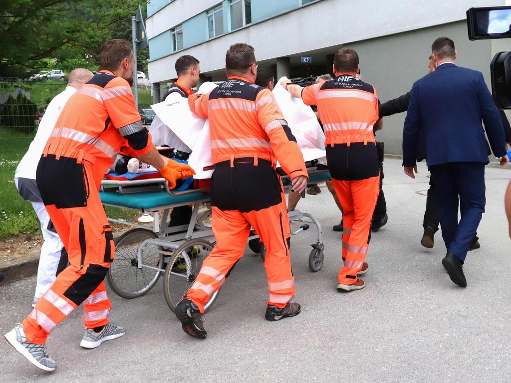 Slovakian Prime Minister Robert Fico being transported by medics and his security detail to the hospital in Banska Bystrica, Slovakia after he was shot “multiple times”. Picture: AFP