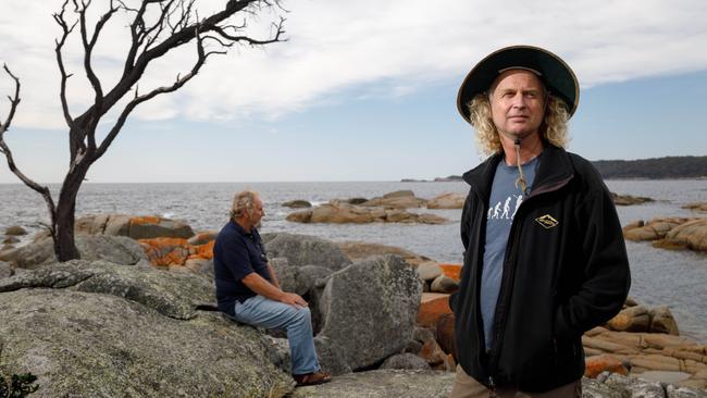 Todd Dudley (R), President North East Bioregional Network Inc, and Peter Nicholls, VP of the Binalong Bay Rate Payers Association, at the Bay of Fires in Tasmania. Dudley and Nicholls are opposed to a proposal to scuttle the ex HMAS Darwin as a dive wreck and artificial reef at Skeleton Bay. The Australian/Peter Mathew