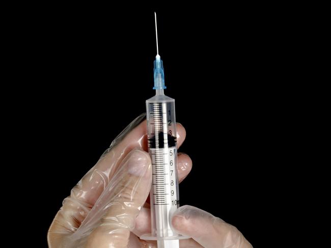 Hand with syringe. Needle. generic