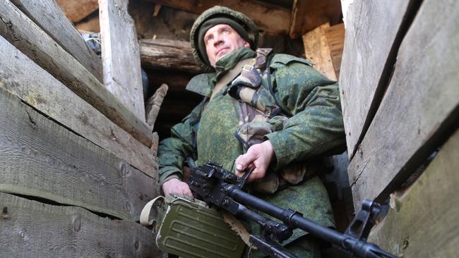 A soldier of the Donetsk People's Militia stationed on the front line near the rural town of Staromikhailovka, west of Donetsk. Picture Getty Images.