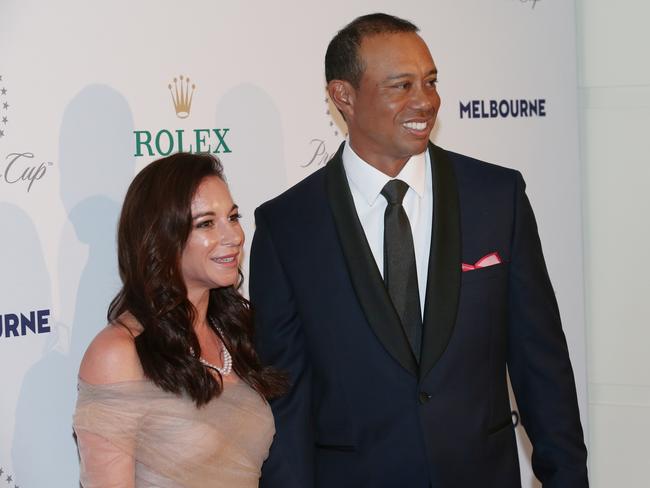 Tiger Woods and his former partner Erica Herman arrive at the Presidents Cup Golf gala at Crown in Melbourne in 2019. Picture: AAP