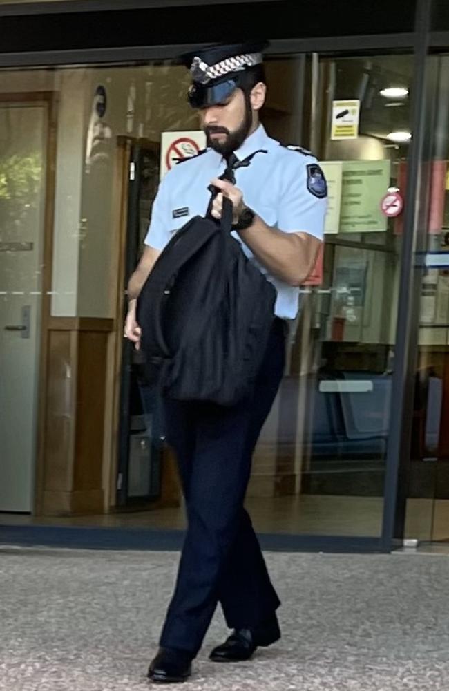 Queensland Police Service Senior Constable Renzo Martinez leaves day two of the inquest.