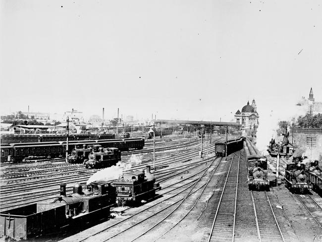 The railway tracks pictured with Flinders Street Station in the background in the early 1900s. Picture: SLV