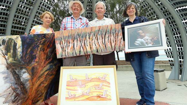 Marie Smith, Owen Hutchison, John Blackley and Zorica Komac with art which will be on display at the Sandgate Easter Art show. Picture: AAP/Jono Searle