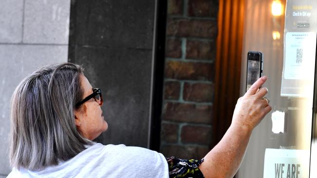 Brisbane people use QR codes to check-in at Southbank. Picture: NCA NewsWire / John Gass