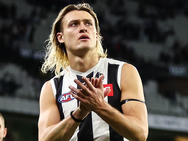 MELBOURNE, AUSTRALIA - JUNE 12: Darcy Moore of the Magpies leads his side off the field after a loss during the 2023 AFL Round 13 match between the Melbourne Demons and the Collingwood Magpies at the Melbourne Cricket Ground on June 12, 2023 in Melbourne, Australia. (Photo by Dylan Burns/AFL Photos via Getty Images)