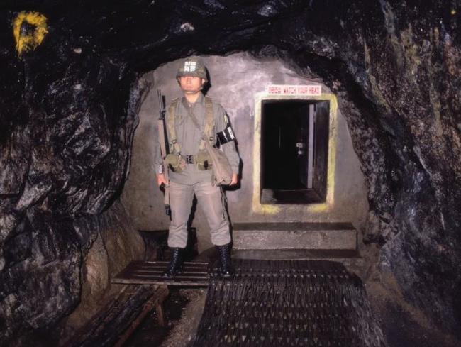 A soldier is pictured standing guard outside the entrance to one of the tunnels. Picture: Getty Images