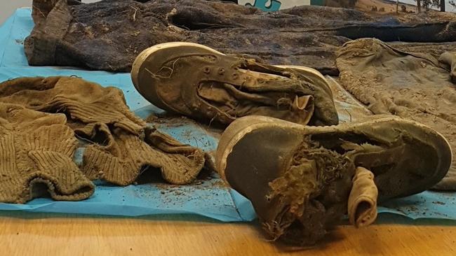 SOMETHING SINISTER? The shoes anbd clothing unearthed suring a search of the area near Keefton Road where a woman’s remains were found last month.