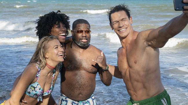 Meredith Hagner as Kyla, Yvonne Orji as Emily, Lil Rel Howery as Marcus and John Cena as Ron in a scene from Vacation Friends.