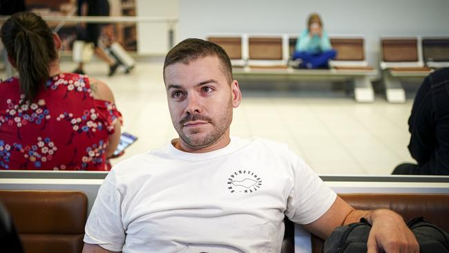 Bali fly-kicking Adelaide tradie Nicholas Carr arrives back in Adelaide. Picture: AAP/Mike Burton