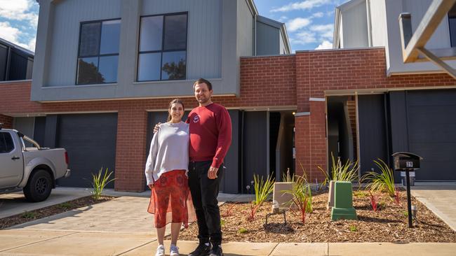 Tim Doherty and Vanessa Reinboth in front of their new Seacombe Gardens home, built with the aid of HomeStart. Picture: Supplied