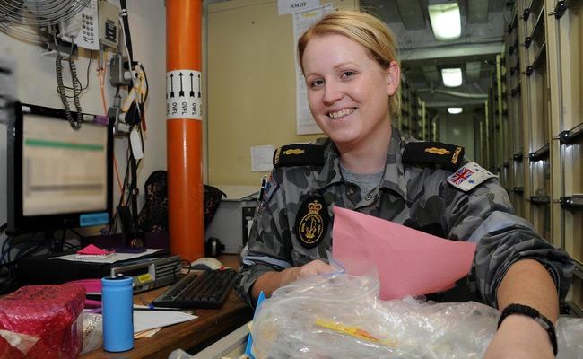 Able Seaman Lisa Thompson putting stock away on board HMAS Melbourne in the Gulf of Aden as part of Operation Slipper. . Picture: Contributed