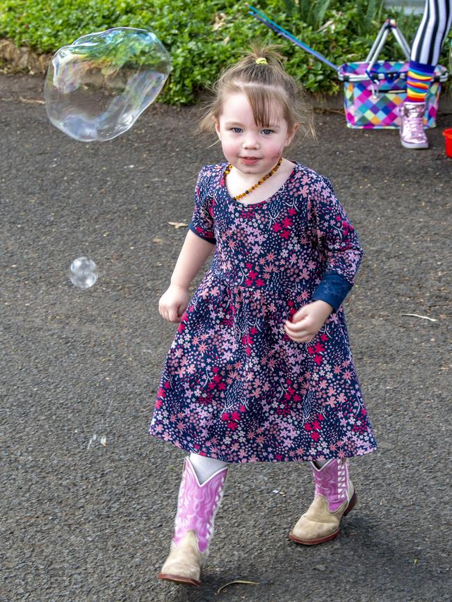 Lilly Naylor chases bubbles on day 3 of the Toowoomba Royal Show. Sunday, March 27, 2022. Picture: Nev Madsen.