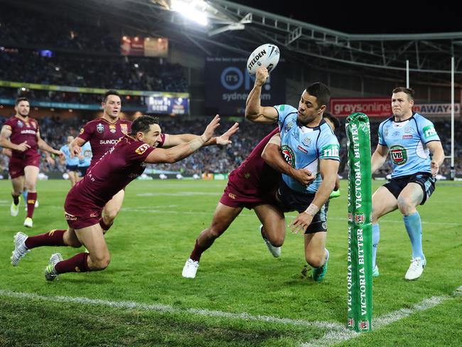 Jarryd Hayne is tackled into touch. Picture: Brett Costello